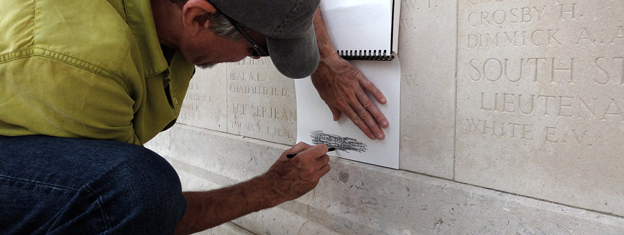 image of us rubbing a name in a WWI monument